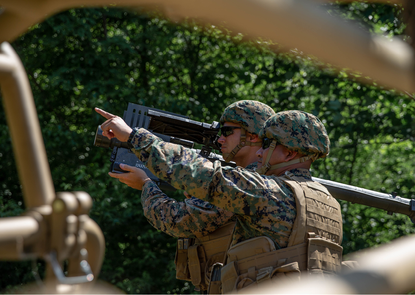 U.S. Marines with the Ground Based Air Defense Program, conduct a demonstration of the Light-Marine Air Defense Integrated System (L-MADIS), on Marine Corps Base Quantico, Virginia, June 30, 2021. The L-MADIS provides both kinetic and non-kinetic defeat capabilities to destroy or negate aerial threats in support of the Marine Air-Ground Task Force. L-MADIS will deploy in support of Marine Expeditionary Units and integrated onto a pair of utility task vehicles. (U.S. Marine Corps photo Lance Cpl. Jessica A. Foraker)
