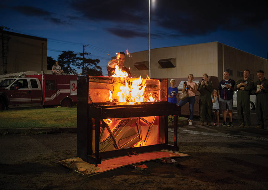 A piano is burned to commemorate the retirement of the UH-1N Huey at Yokota Air Base, Japan, Sept. 5, 2025. The UH-1N first arrived at Yokota in 1980, and for over 45 years, the aircraft supported a wide range of missions across the region, including aeromedical evacuations and the transport of senior government officials. It also played a critical role in Operation Tomodachi following the Great East Japan Earthquake of 2011, conducting reconnaissance flights and low-level radiation mapping in the aftermath of the Fukushima Daiichi Nuclear Plant disaster. (U.S. Air Force photo by Staff Sgt. Natalie Doan)