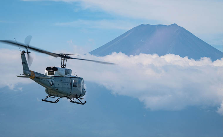 A U.S. Air Force UH-1N Huey assigned to the 459th Airlift Squadron approaches Mount Fuji during its final operational flight at Yokota Air Base, Japan, Aug. 29, 2025. The UH-1N Huey has maintained a presence at Yokota for 45 years, providing aeromedical evacuation, search and rescue and priority airlift missions throughout the Pacific. (U.S. Air Force photo by Senior Airman Jacob Wood)