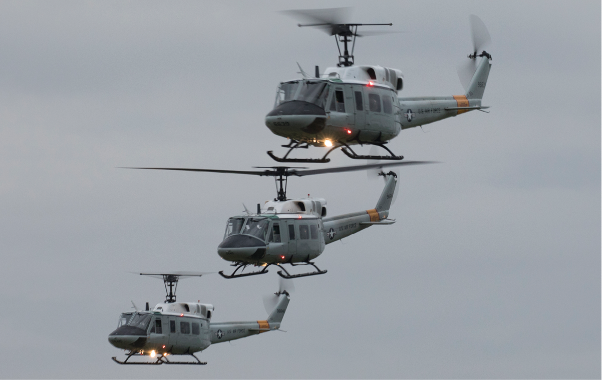 Three UH-1N Iroquois helicopters assigned to the 459th Airlift Squadron fly in formation during a training mission over Yokota Air Base, Japan, Oct. 2, 2017. The 459 AS regularly conducts training missions to remain proficient with flight skills necessary to support contingencies. (U.S. Air Force photo by Yasuo Osakabe)