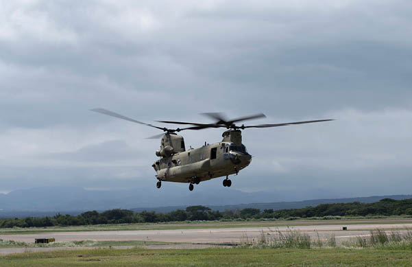 A U.S. Army CH-47 Chinook assigned to the 1st Battalion, 228th Aviation Regiment, Joint Task Force-Bravo, departs for a forward deployment to Jamaica, Oct. 30, 2025, at Soto Cano Air Base, Honduras. JTF-B service members forward deployed as part of the initial effort to provide immediate, lifesaving and foreign assistance following Hurricane Melissa. (U.S. Air Force photo by Staff Sgt Merchak)
