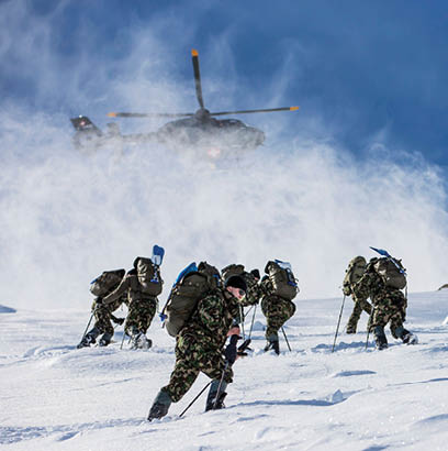 A group of soldiers are walking up a snowy hill, some of them carrying backpacks. AI generated content
