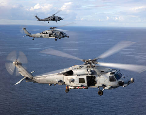 Two helicopters flying over the ocean. AI generated content