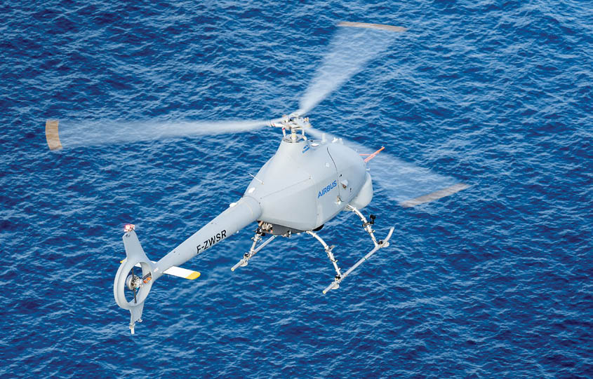 A helicopter is flying over the ocean with a person hanging from it. AI generated content