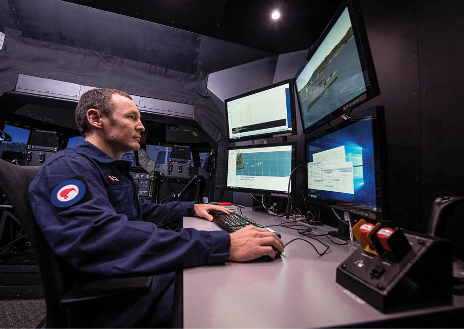 A man in a blue uniform is sitting in front of a computer with multiple screens. AI generated content