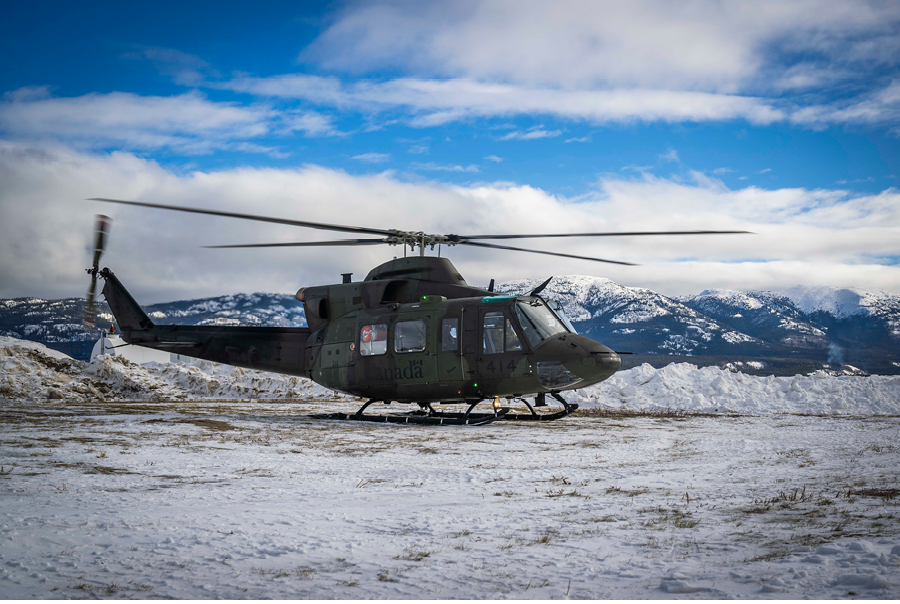 A helicopter is parked on a snowy field. AI generated content