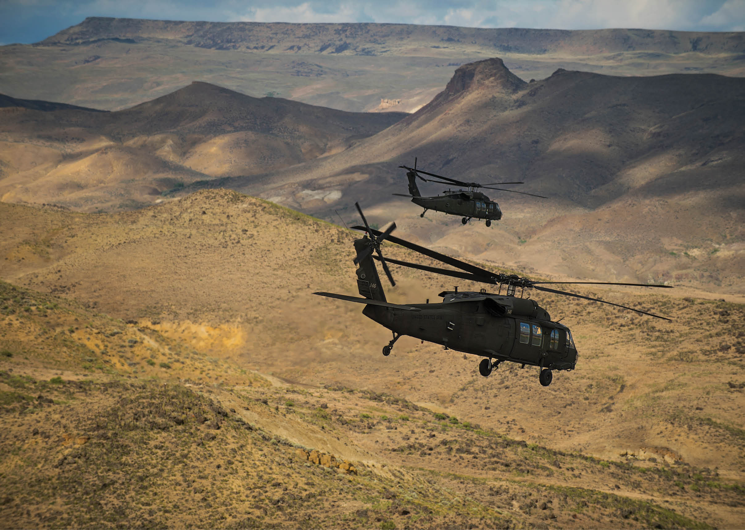 Three helicopters flying in the sky over a mountain range. AI generated content