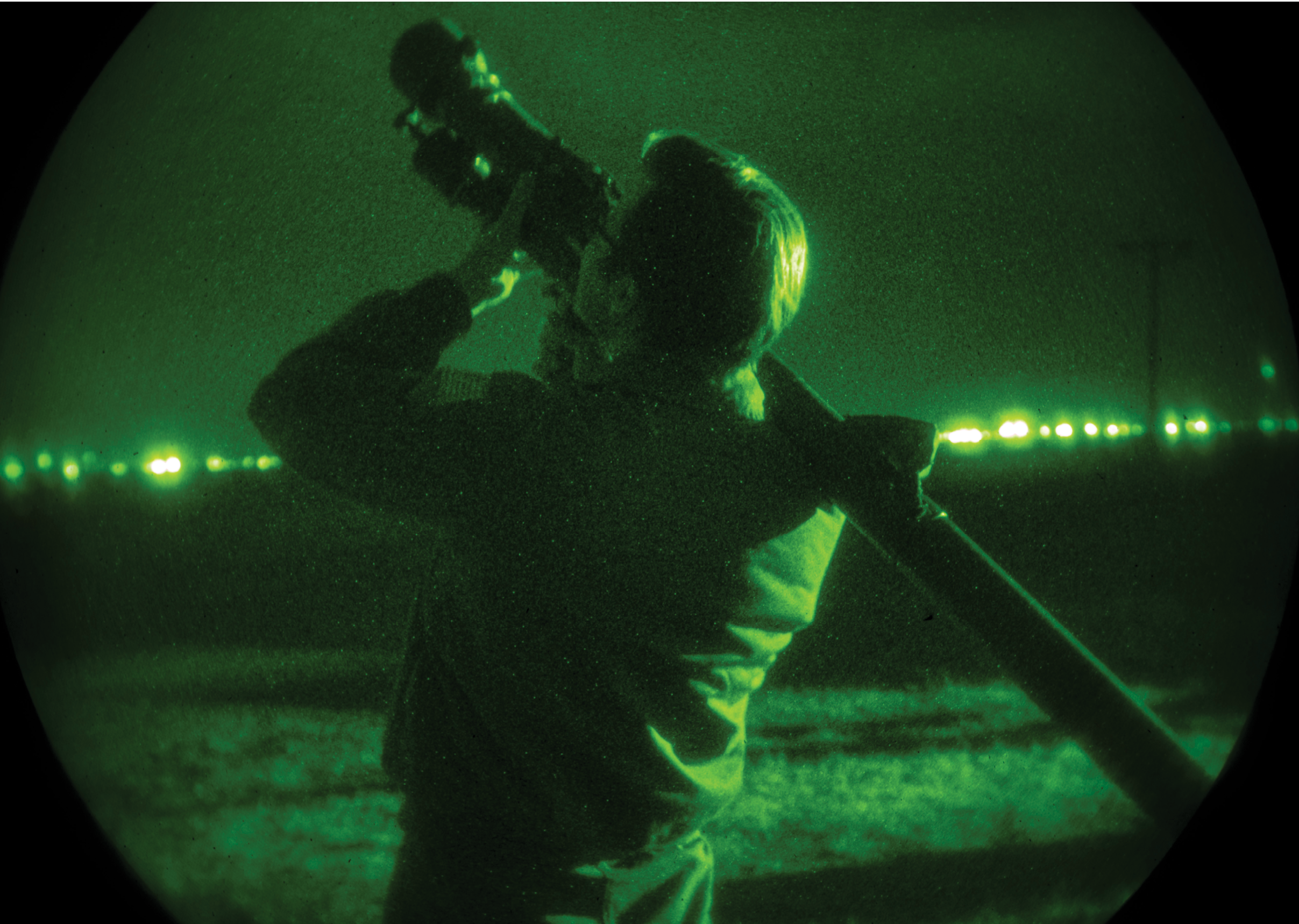 A man is holding a camera up to his face, looking through the lens. AI generated content