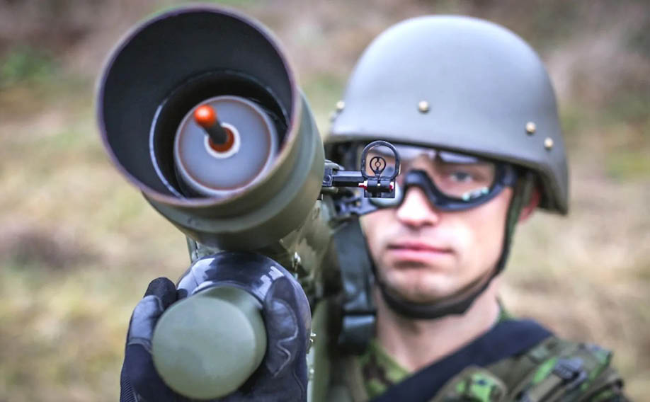 A man in a camouflage uniform is holding a gun. AI generated content