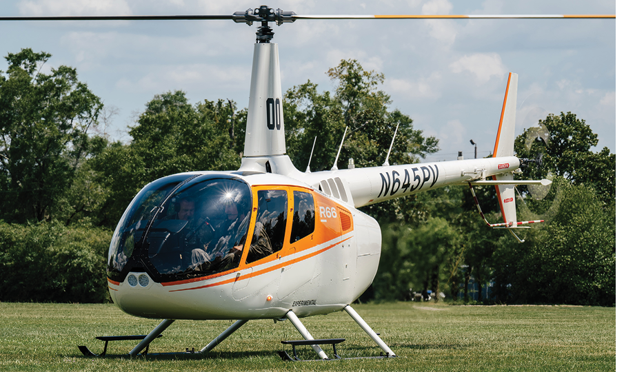 A small helicopter with a man inside is parked on the grass. AI generated content