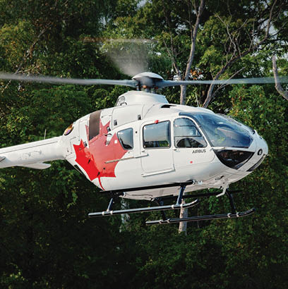 A helicopter with a Canadian flag painted on it is flying over a forest. AI generated content