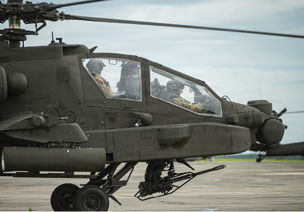 A helicopter with two pilots in the cockpit. AI generated content