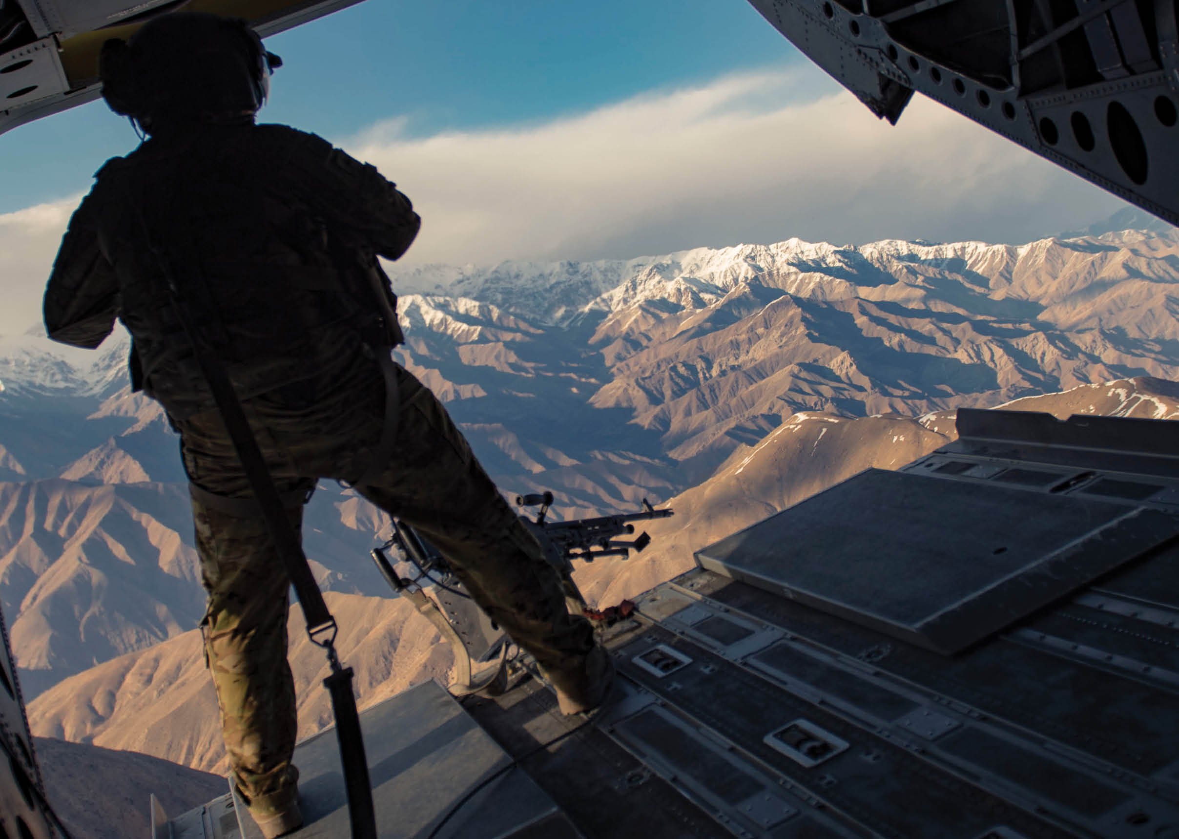 A man in a military uniform is standing on a plane wing. AI generated content