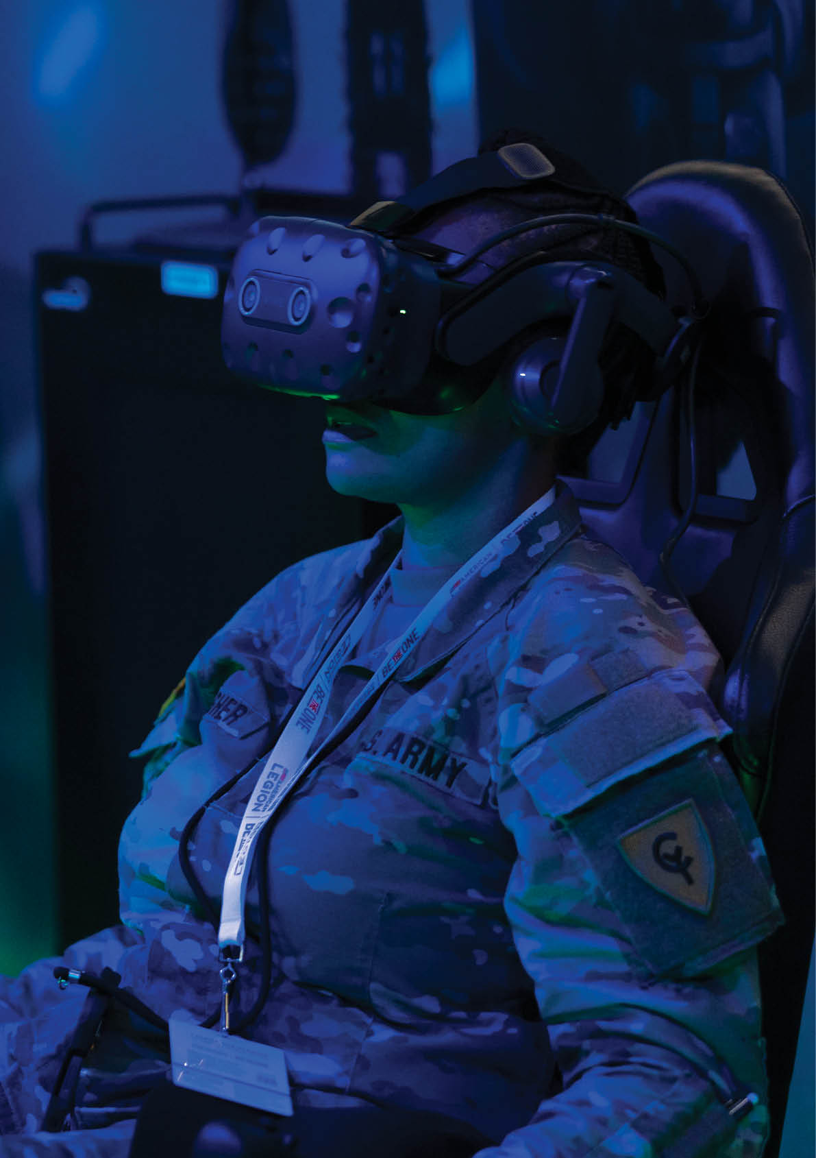 A woman wearing a camouflage uniform is sitting in a chair and using a virtual reality headset. AI generated content