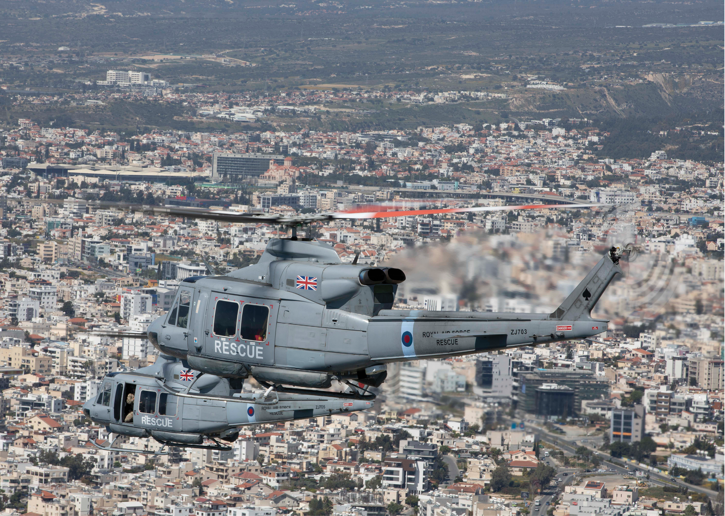 A helicopter is flying over a city with a large building in the background. AI generated content