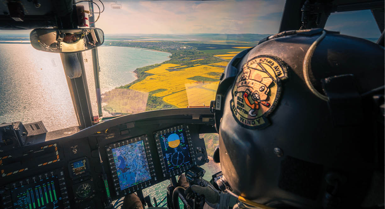 A man is sitting in a helicopter cockpit with a view of the ocean. AI generated content
