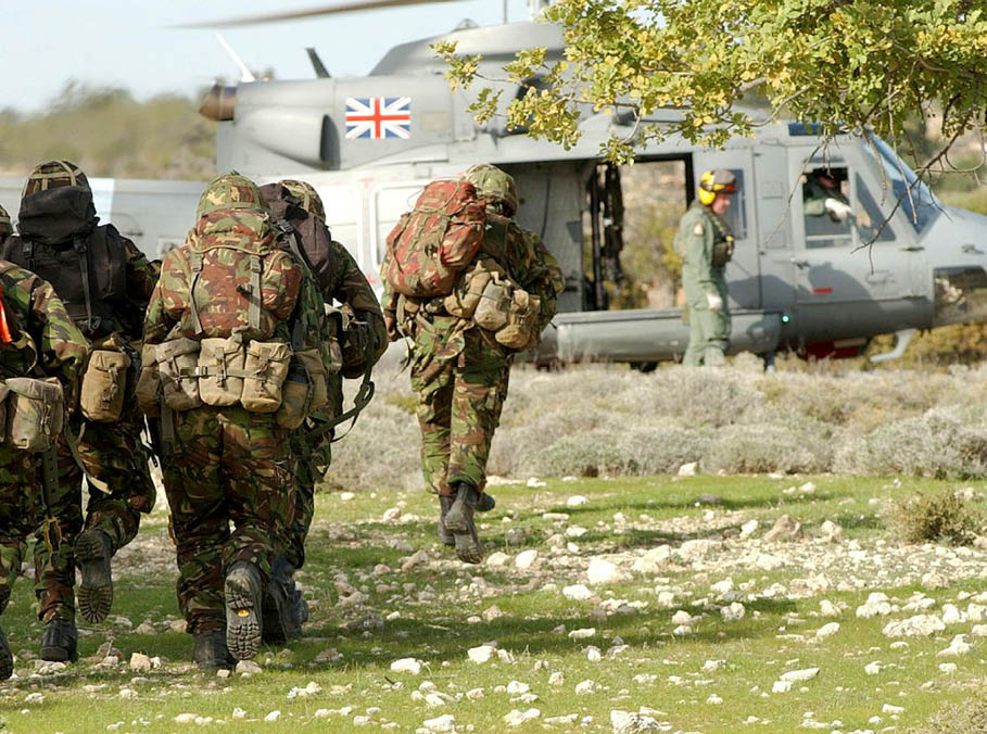 A group of soldiers wearing camouflage uniforms are walking towards a helicopter. AI generated content