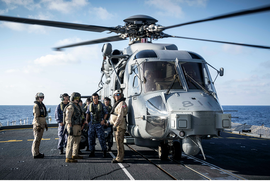 A group of people are standing on a boat next to a helicopter. AI generated content