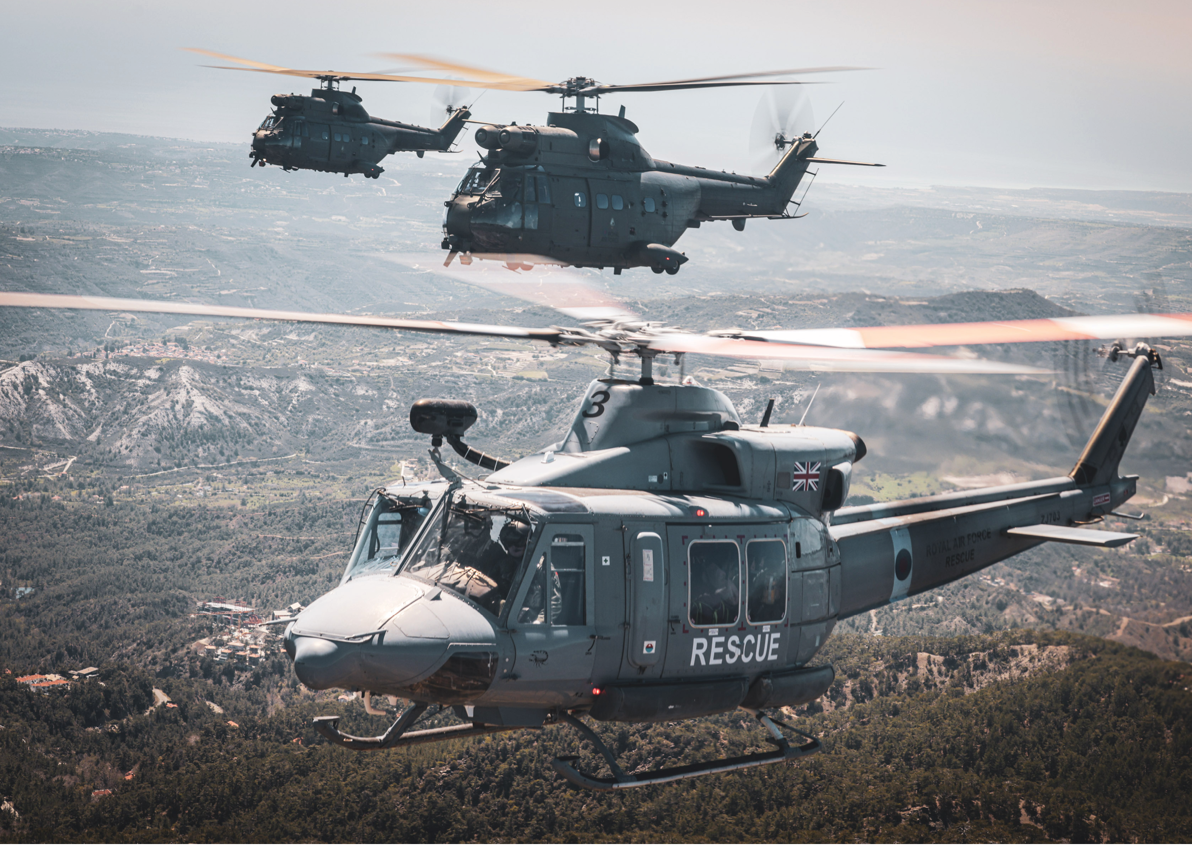 Two helicopters flying in the sky, one is a rescue helicopter. AI generated content