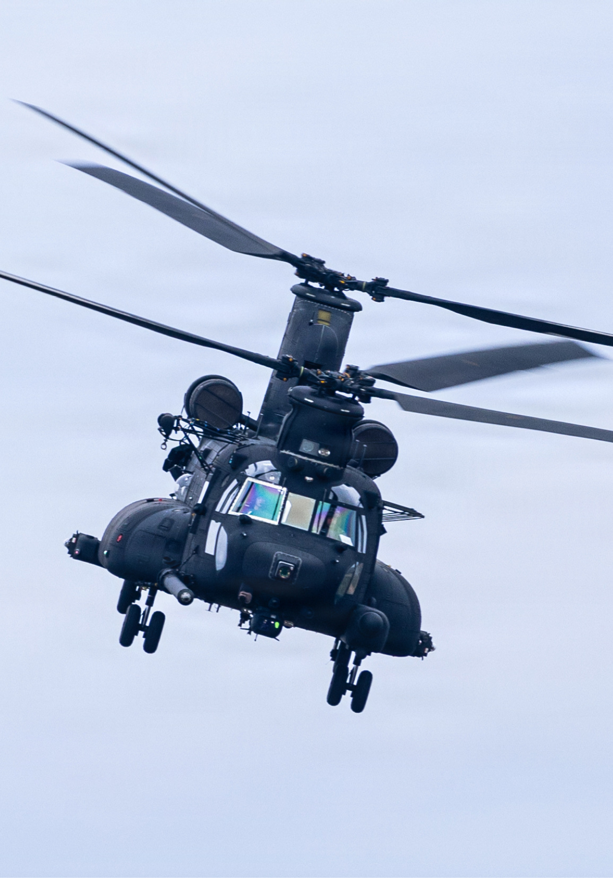 A helicopter with two large blades is flying in the sky. AI generated content