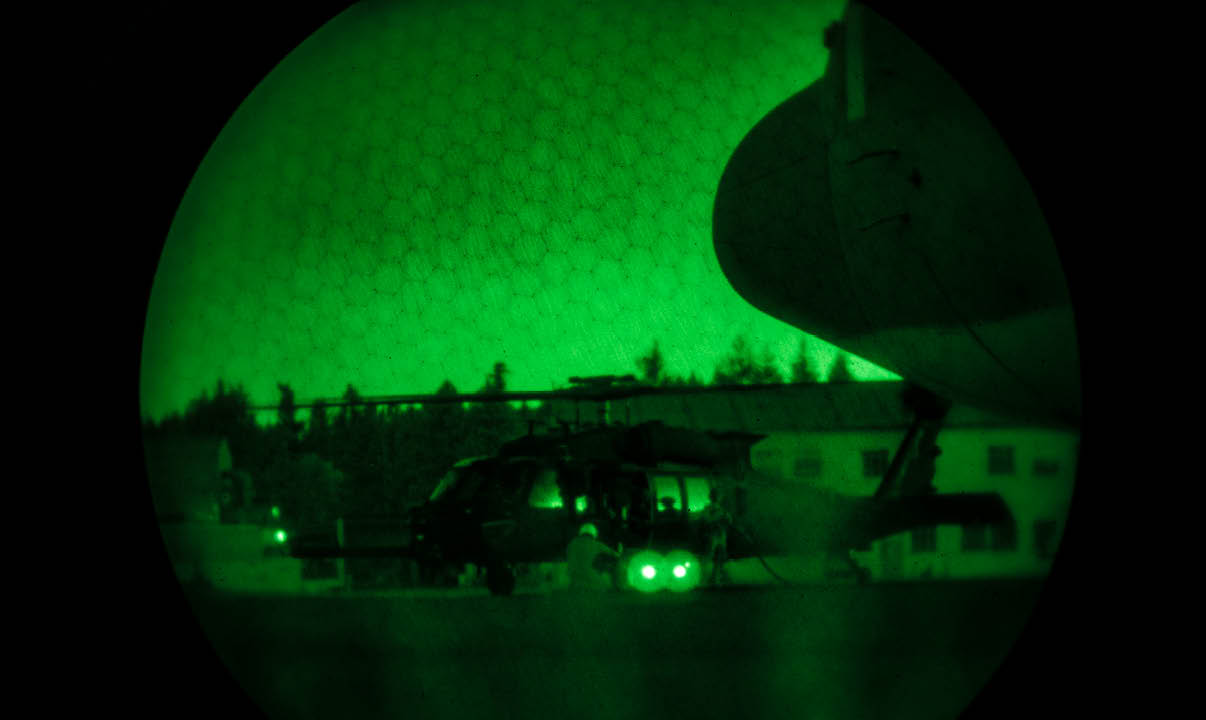 A helicopter is parked on the ground, and a green light is shining on it. AI generated content