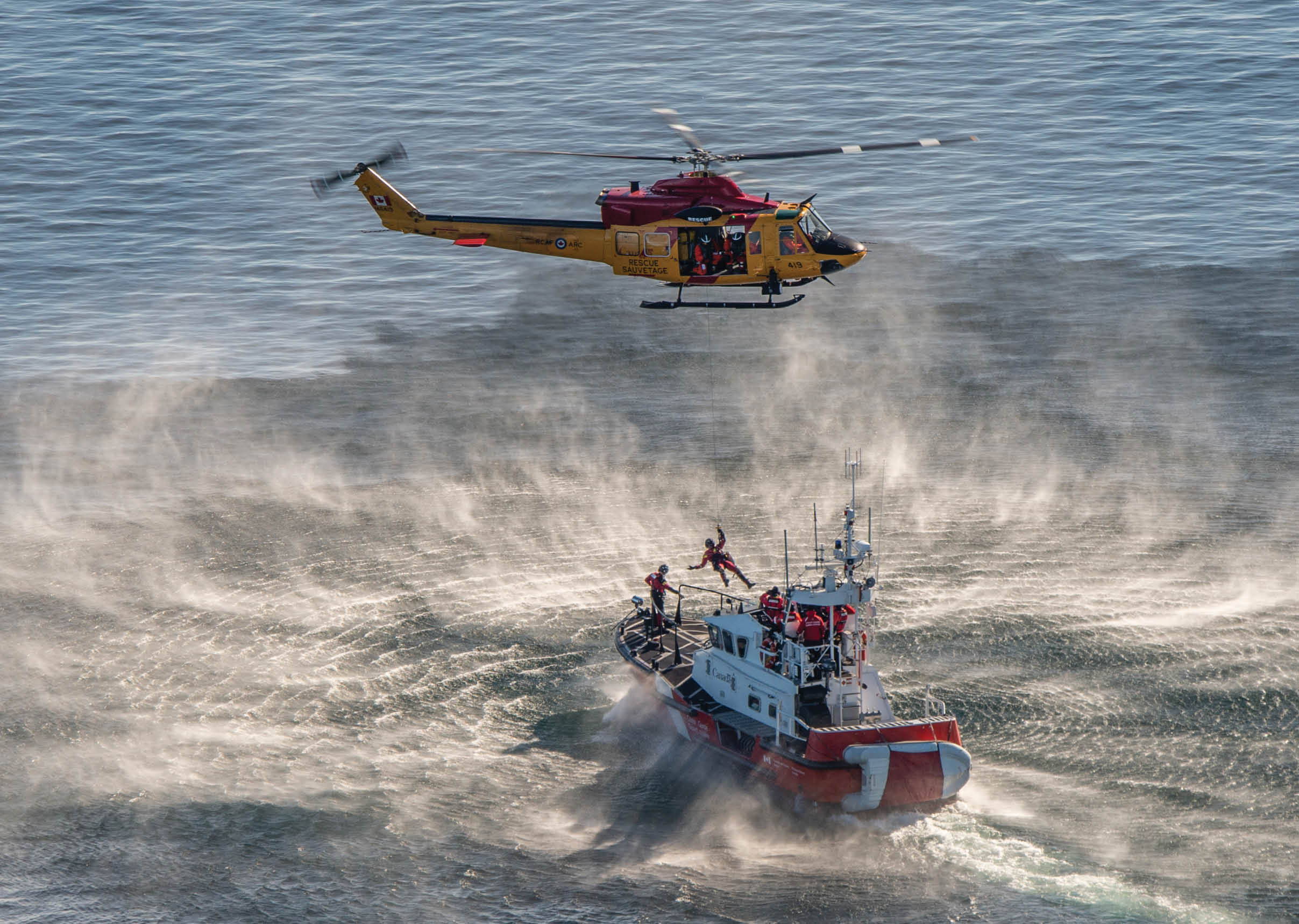 A helicopter is flying over a boat in the ocean. AI generated content