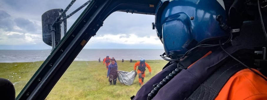 A person wearing a helmet and orange shirt is in a helicopter. AI generated content