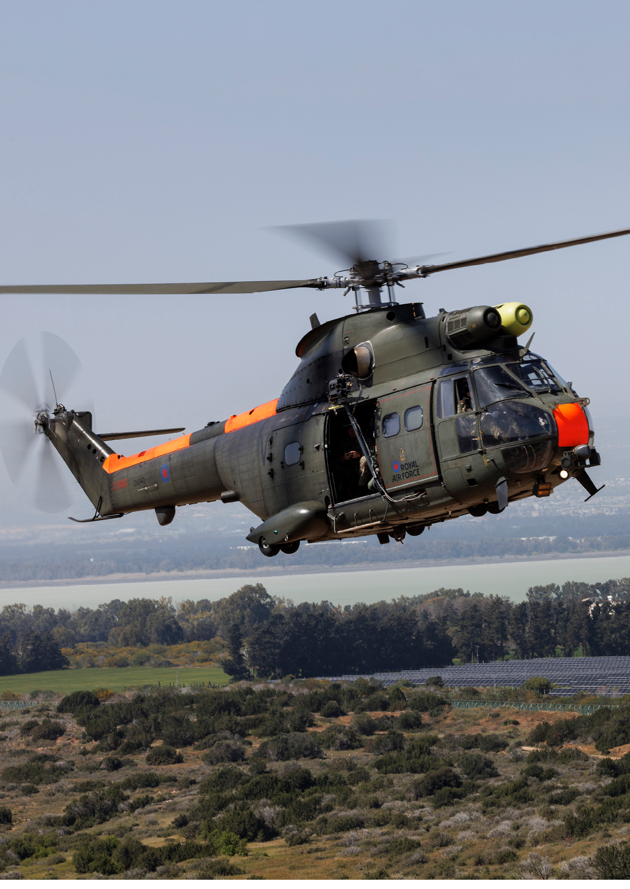 A helicopter is flying in the air with a person inside. AI generated content