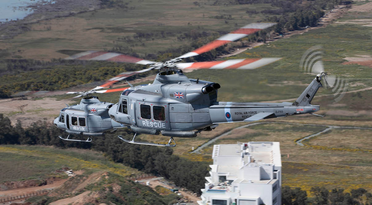 A helicopter is flying over a field with a building in the background. AI generated content
