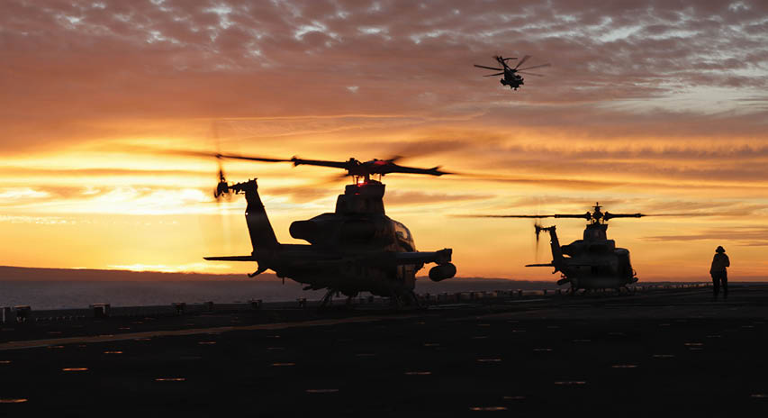 Three helicopters are parked on a runway at sunset. AI generated content