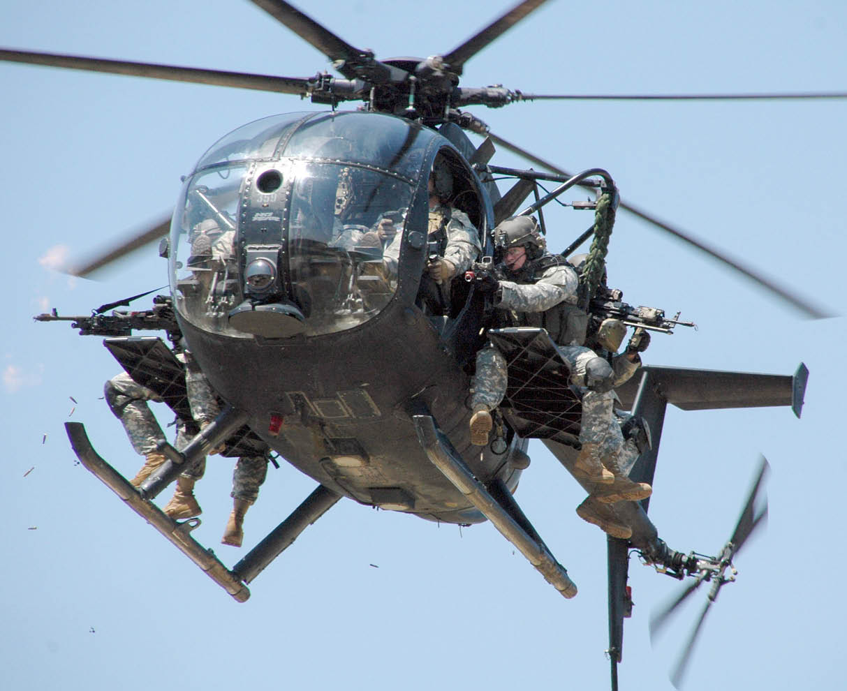 A helicopter with a group of soldiers on it. Description generated by AI