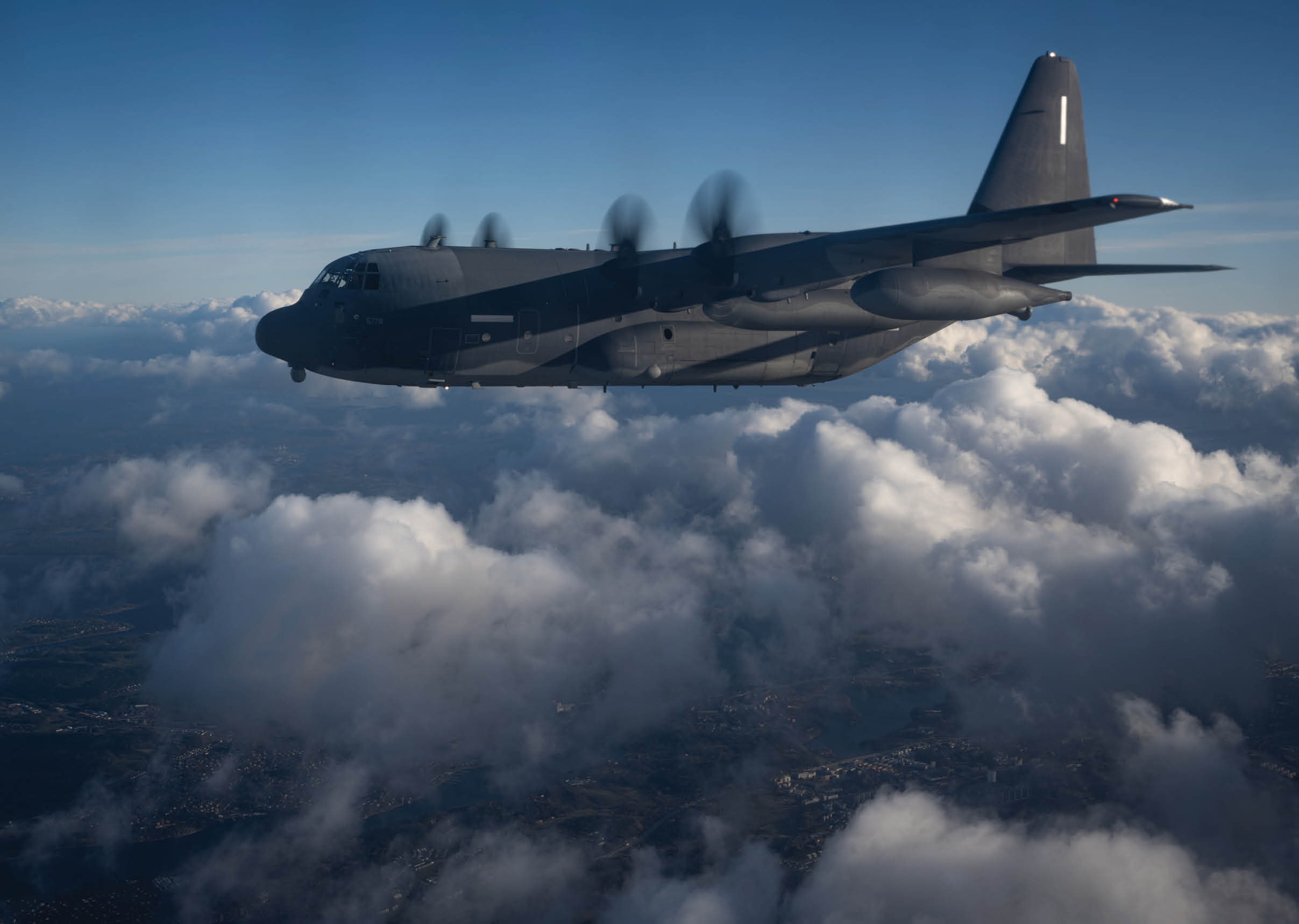 A plane flying through the clouds. Description generated by AI