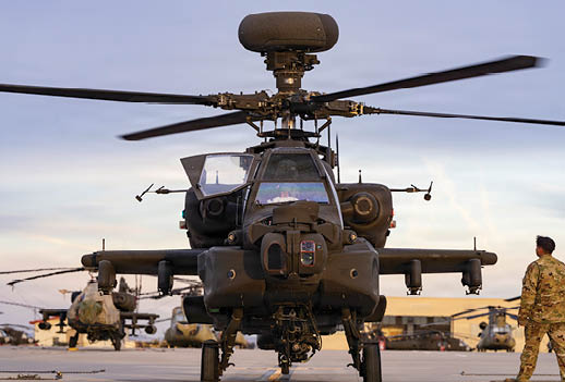 A helicopter with a large antenna on top of it. Description generated by AI