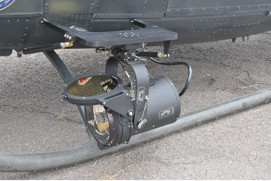 A helicopter with a camera mounted on the front. Description generated by AI