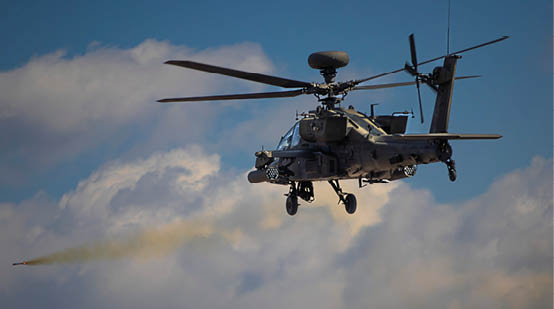 A helicopter is flying in the sky and shooting a missile. Description generated by AI