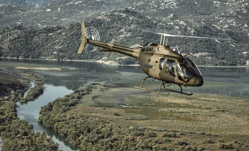 A helicopter flying over a river. Description generated by AI
