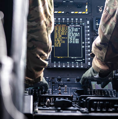 Two men are in a cockpit of a plane. Description generated by AI