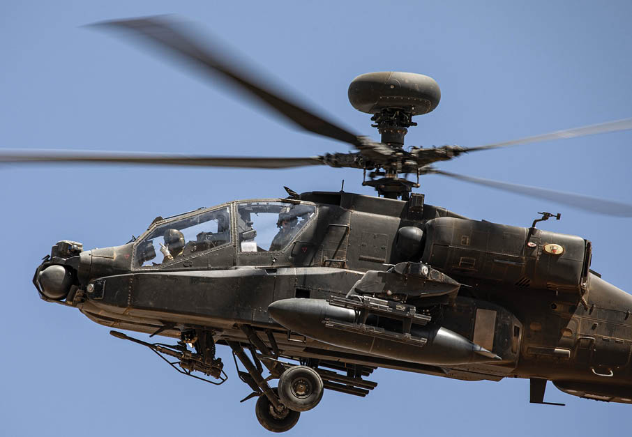 A helicopter flying in the air. Description generated by AI