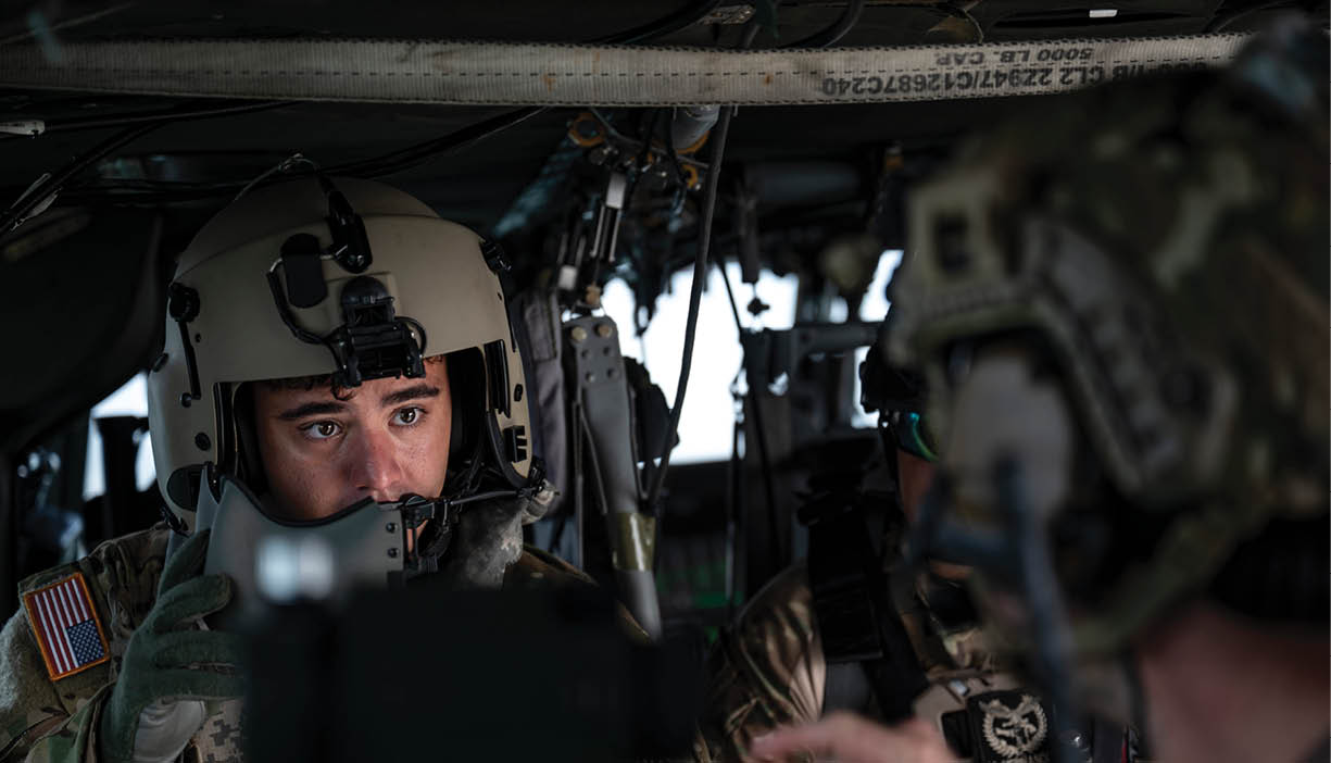 A person wearing gloves is touching a control panel. Description generated by AI