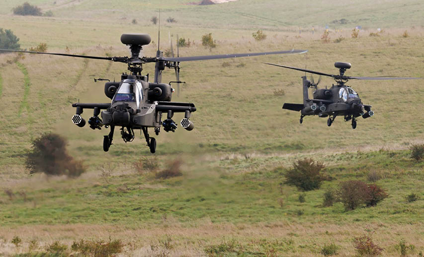A helicopter flying in the air. Description generated by AI