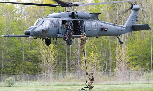 Two helicopters flying in the sky. Description generated by AI