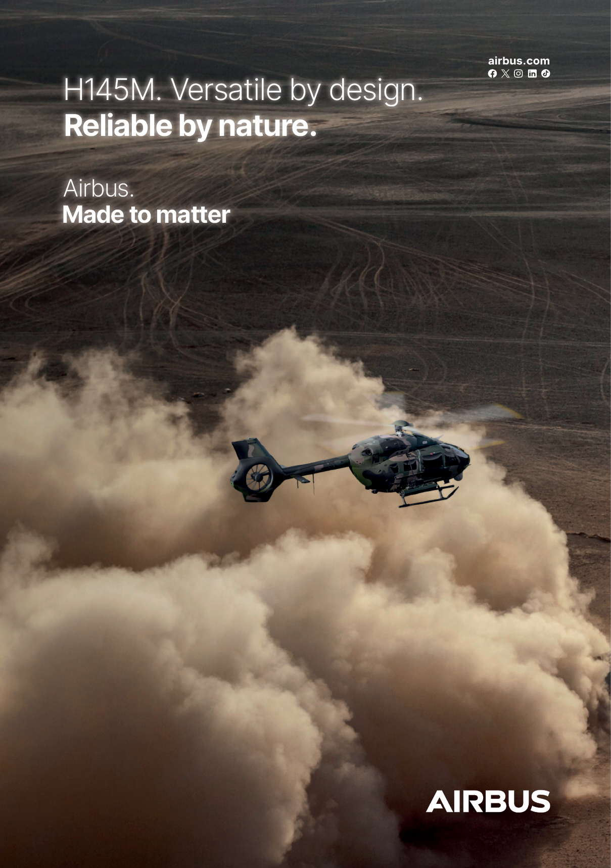 An Airbus helicopter is flying over a desert. Description generated by AI