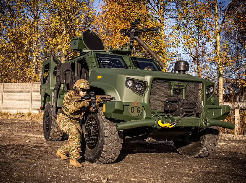A man in camouflage is standing next to a green truck. AI generated content