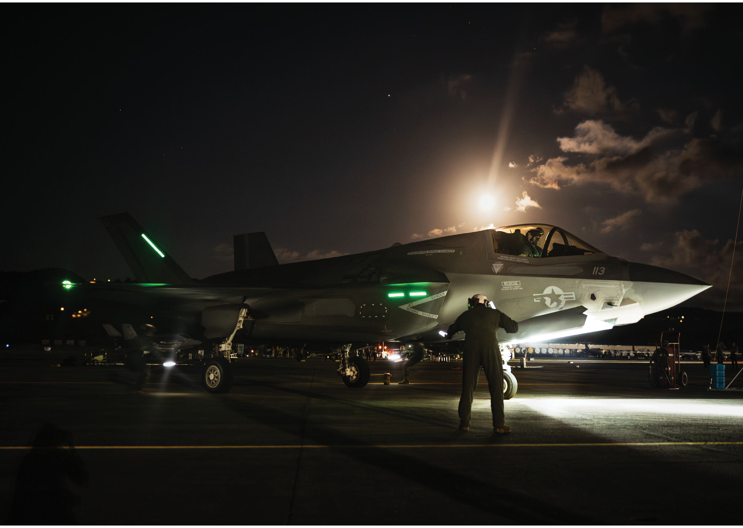 A man is standing next to a fighter jet on the runway. AI generated content