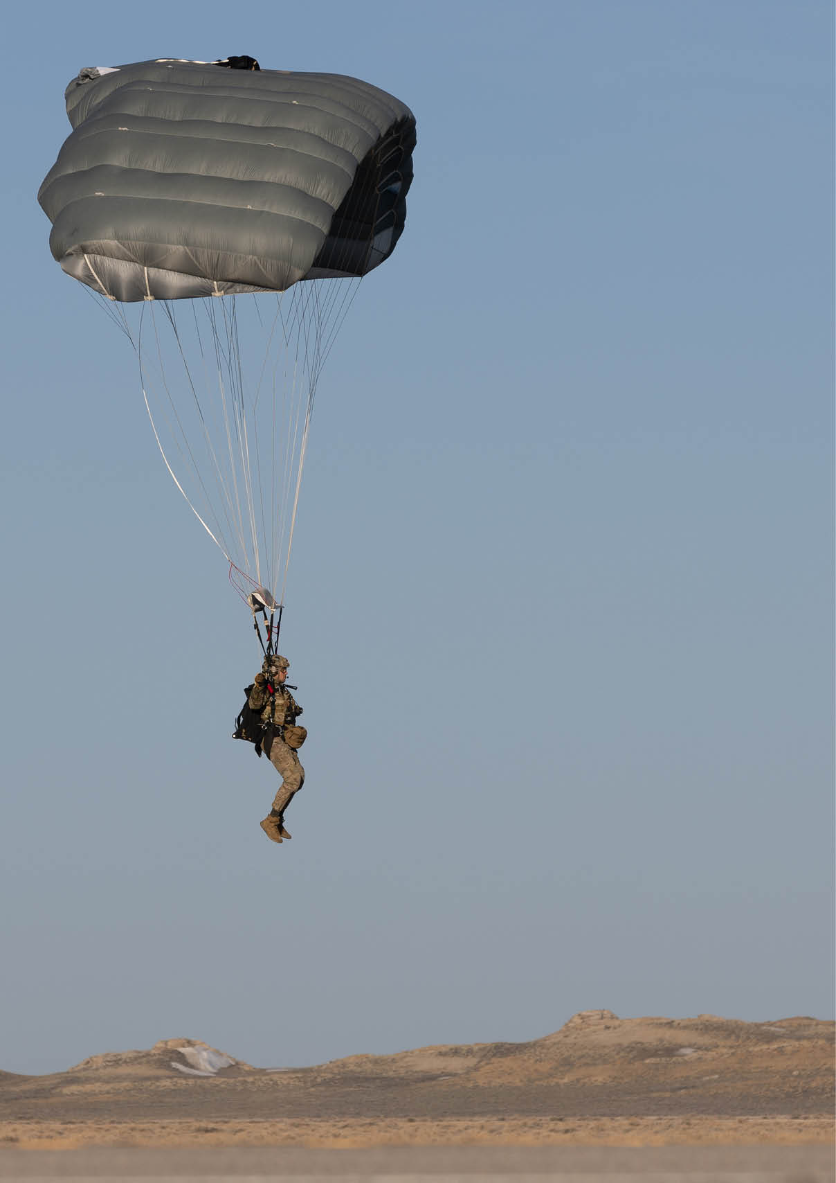 A person is hanging from a parachute in the sky. AI generated content