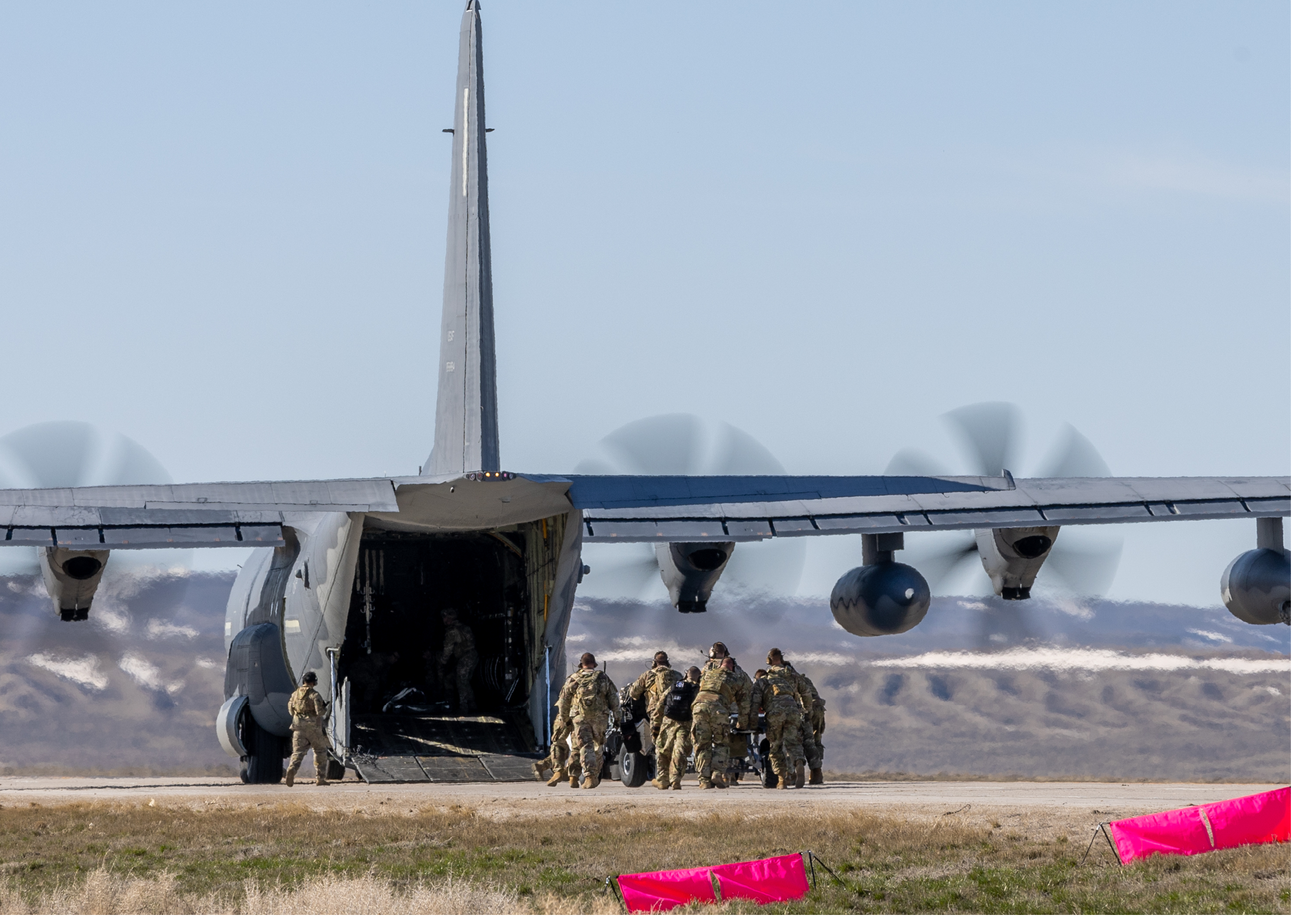 A group of soldiers are unloading from a military plane. AI generated content