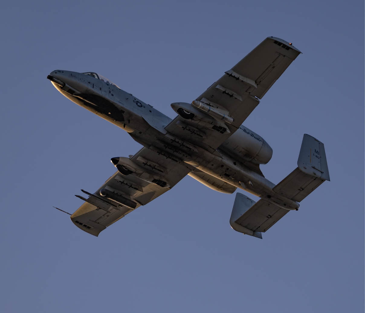 A military plane is flying in the sky. AI generated content