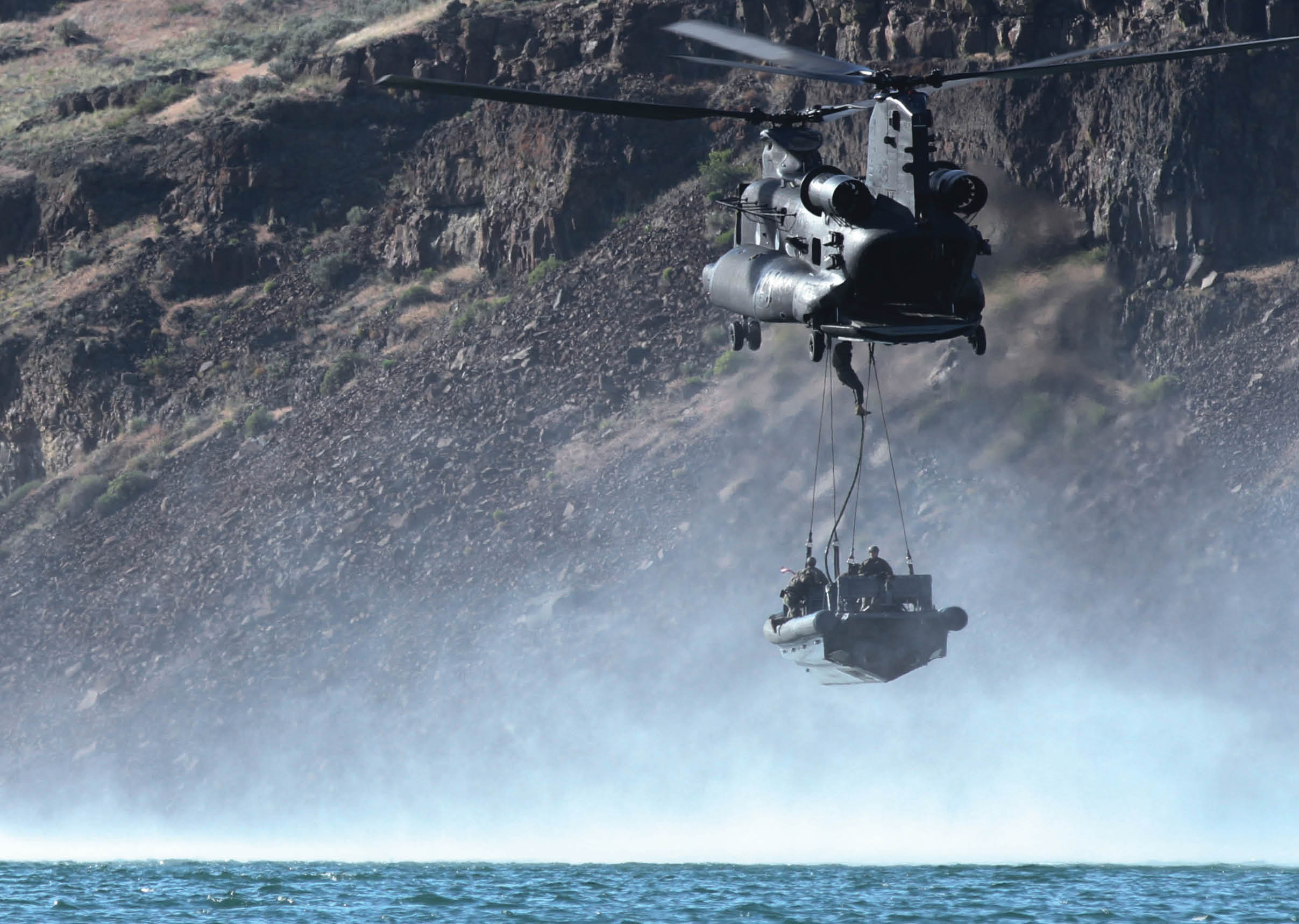 A helicopter is flying over a body of water, carrying a person in a boat. AI generated content