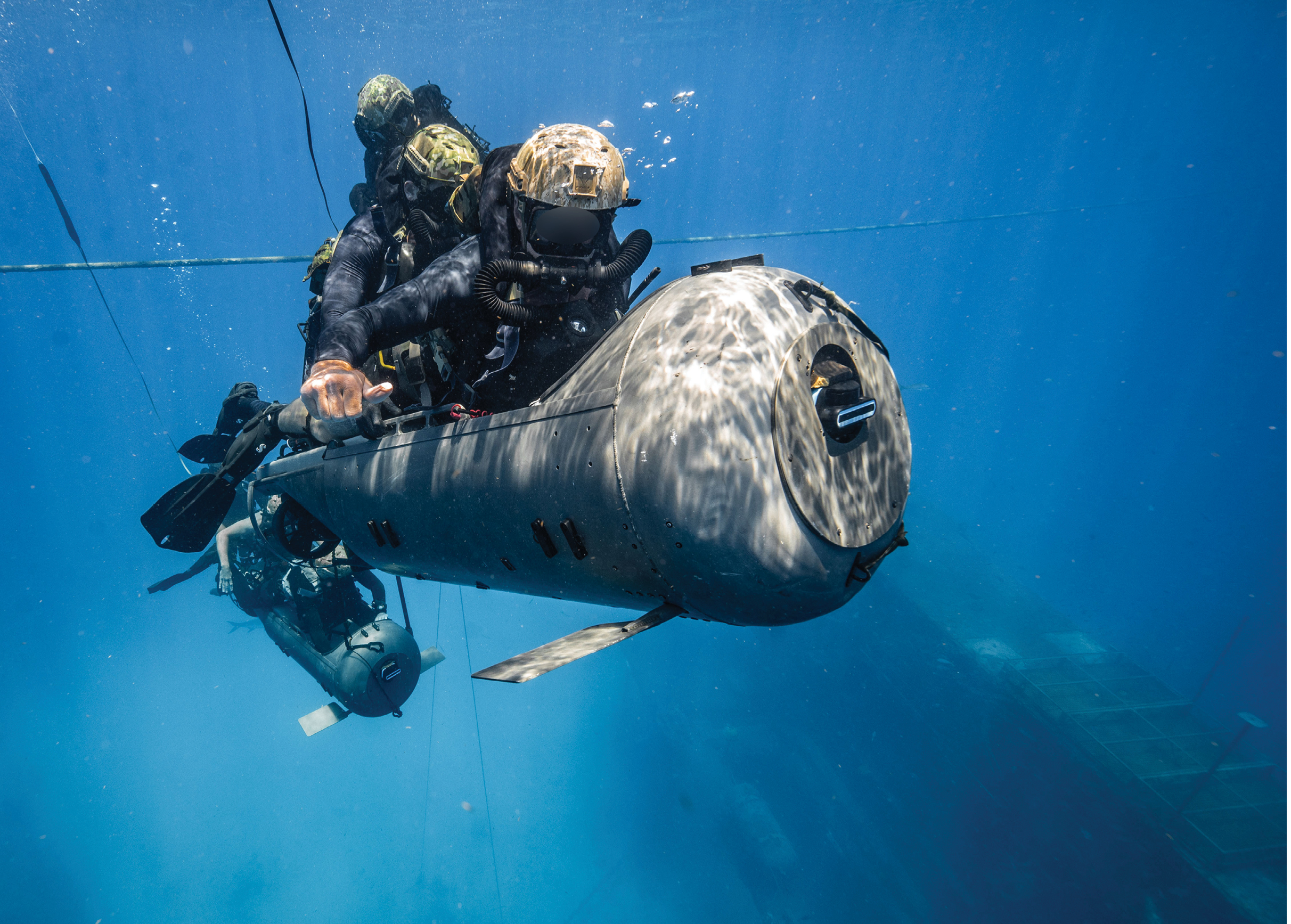 Two men are in the water, one is sitting on a submerged object and the other is standing nearby. AI generated content