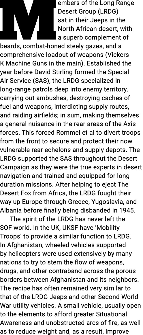 Members of the Long Range Desert Group (LRDG) sat in their Jeeps in the North African desert, with a superb complemen...